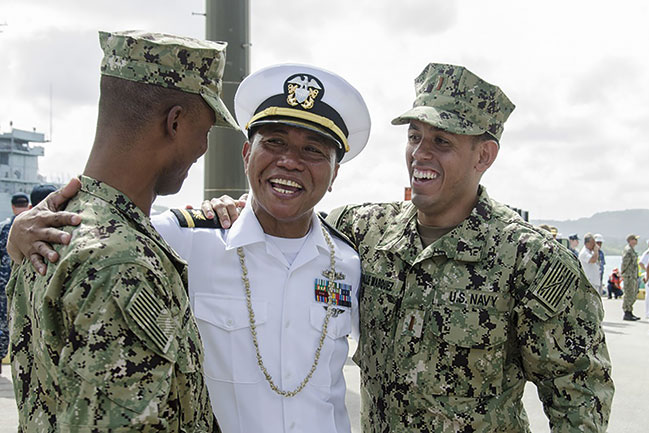 Photo of three men smiling